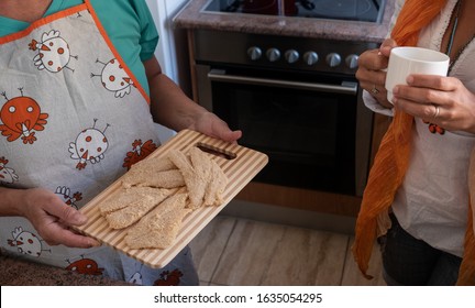 Break Tea In The Kitchen After Preparing Filets For Fried Fish. Family Positive Moments With Two People