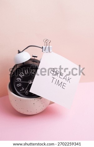 Break time. Coffee and clock on a colored background. Time to drink coffee. Creative idea
