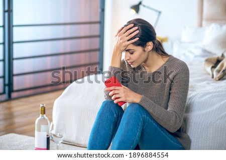 Break up. Young woman feeling stressed and drinking alcohol
