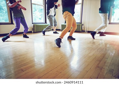 Breakdance, group and practice with motion, studio and freedom for creative art performance. People, culture and hip hop with dance, rehearsal and energy for community expression in dancing class - Powered by Shutterstock