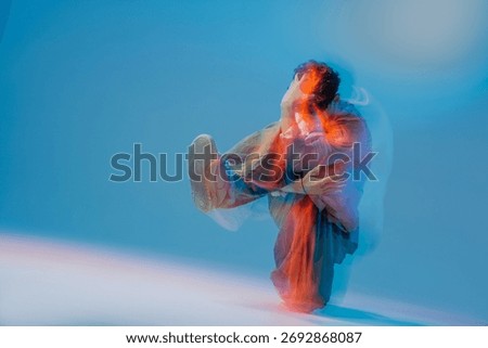 Breakdancer performs a power move with motion blur and neon gels, ideal for youth culture ads, music promos, posters, and social media campaigns.
