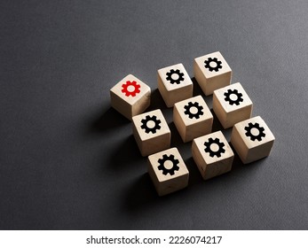 Breakdown in the production system, deviation from the norms, broken part or violation of order, malfunction failure. Wooden cubes with production process icons.
