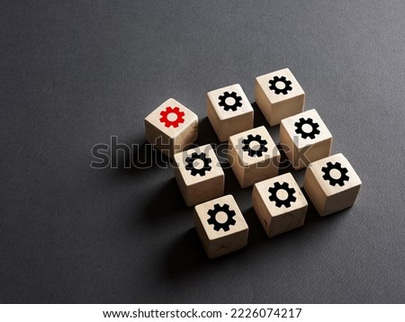Breakdown in the production system, deviation from the norms, broken part or violation of order, malfunction failure. Wooden cubes with production process icons.