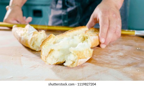 Breaked Steaming Fresh Bread On The Table At Commercial Kitchen Of Bakery, Quality Test Bakery Production.