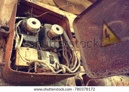 Breaker and switch in Control box. Circuit board connection. Electric system. Industrial background. Overloaded electrical circuit causing fuse to break. Retro electric power boxes. Danger sign.