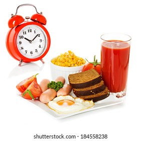 Breakfast and alarm clock - Shutterstock ID 184558238