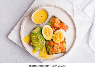 Breakfast With Avocado Toast, Salmon And Hollandaise Sauce