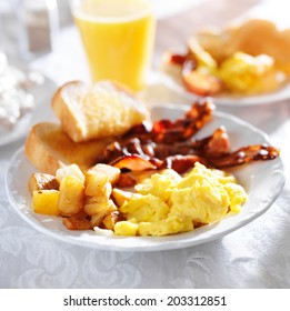 Breakfast With Bacon, Eggs And Home Fries