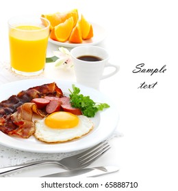 Breakfast With Bacon, Fried Egg And Orange Juice On White Isolated Background(With Sample Text)