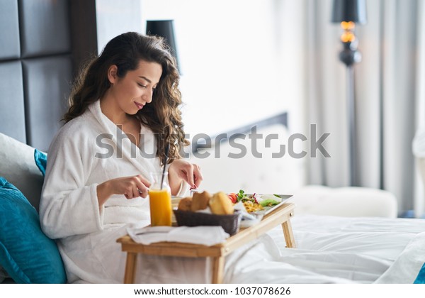 Breakfast in bed, cozy\
hotel room. concept