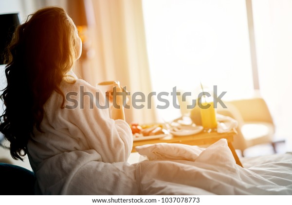 Breakfast in bed, cozy\
hotel room. concept