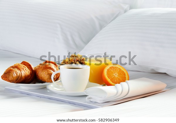 Breakfast in bed in\
hotel room.\
Accommodation.