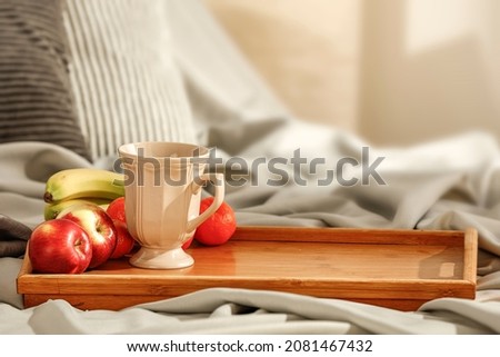 Similar – Image, Stock Photo Healthy breakfast on tray and couple lying in background