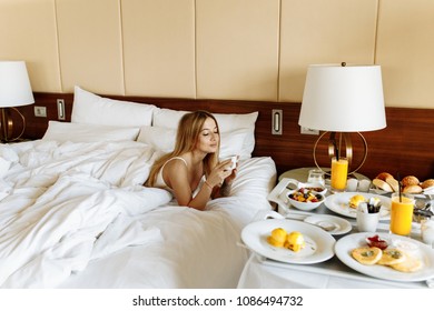 Breakfast in bed for pretty woman. Good morning.  Dream of every woman