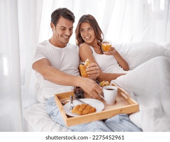 Breakfast, bedroom love and couple smile with morning food, bond and enjoy quality time together in Toronto Canada. Marriage romance, room service meal or people relax on hotel bed for Valentines Day - Powered by Shutterstock