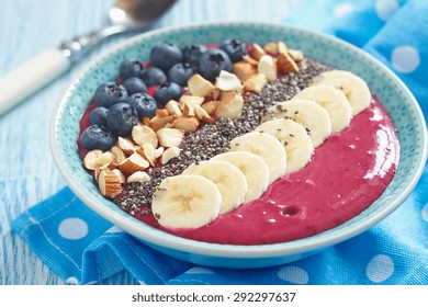 Breakfast Berry Smoothie Bowl Topped With Blueberry,almond, Banana And Chia Seeds