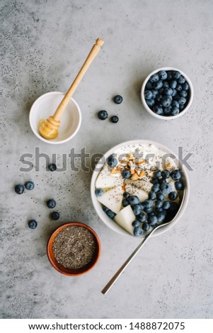 Similar – Zutaten für ein gesundes Frühstück mit Joghurt, Beeren und Chiasamen. Eine leere Schüssel, Draufsicht.