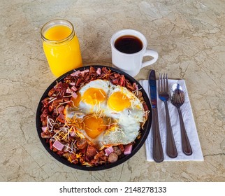 Breakfast Bowl With Ham, Sausage, Potatoes And Eggs