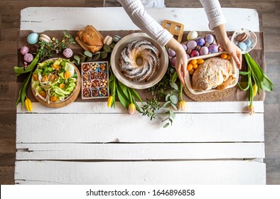 Breakfast Or Brunch Table Setting Full Of Healthy Ingredients For A Delicious Easter Meal With Friends And Family Around The Table. The Concept Of The Easter Holiday And Family Values.