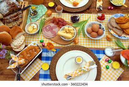 Breakfast Or Brunch Table Setting  Full Of Healthy Ingredients For A Delicious Easter Meal With Friends And Family Around The Table
