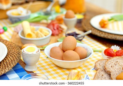 Breakfast Or Brunch Table Setting  Full Of Healthy Ingredients For A Delicious Easter Meal With Friends And Family Around The Table
