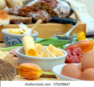 Breakfast Or Brunch Table Setting Full Of Healthy Ingredients For A Delicious Easter Meal With Friends And Family Around The Table  
