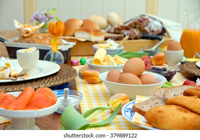 Breakfast Or Brunch Table Setting Full Of Healthy Ingredients For A Delicious Easter Meal With Friends And Family Around The Table 
