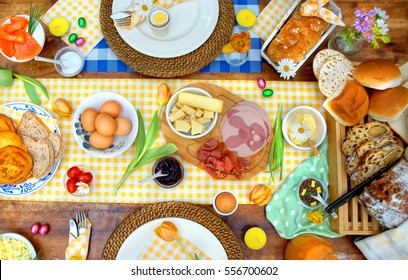 Breakfast Or Brunch Table Setting Full Of Healthy Ingredients For A Delicious Easter Meal With Friends And Family Around The Table 
