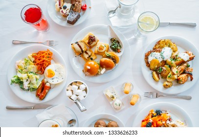 Breakfast Buffet Concept, Breakfast Time in Luxury Hotel, Brunch with Family in Restaurant, Top View of the Table with Plates of Food for Breakfast - Image