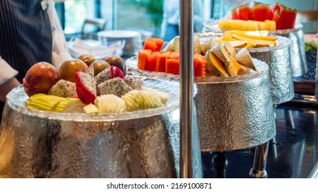 Breakfast Buffet In Modern Hotel. A Variety Of Freshly Tropical Fruits In Luxury Hotel. Catering Banquet Table With Food Indoor In Restaurant With Colorful Fruit Platter. Concept Of Summer Vacation