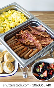 Breakfast buffet with scrambled eggs, sausage and bacon