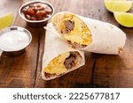 Breakfast burrito with sausage, scrambled eggs, hashbrown potatoes and cheese