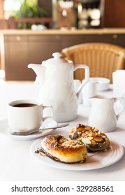 Breakfast with cake and coffee in the kitchen