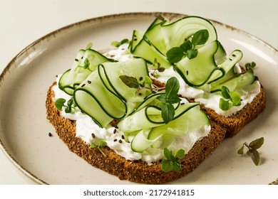 Breakfast, Cereal Bread Sandwiches, Cream Cheese, Sliced Cucumber, With Micro Greenery On A Light Table, Close-up, Top View, Selective Focus, No People,