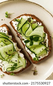 Breakfast, Cereal Bread Sandwiches, Cream Cheese, Sliced Cucumber, With Micro Greenery On A Light Table, Close-up, Top View, Selective Focus, No People,