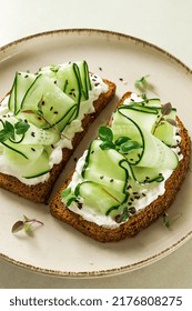 Breakfast, Cereal Bread Sandwiches, Cream Cheese, Sliced Cucumber, With Micro Greenery On A Light Table, Close-up, Top View, Selective Focus, No People,