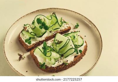 Breakfast, Cereal Bread Sandwiches, Cream Cheese, Sliced Cucumber, With Micro Greenery On A Light Table, Close-up, Top View, Selective Focus, No People,