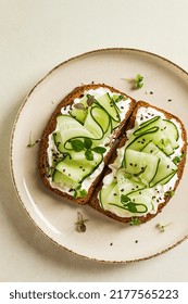 Breakfast, Cereal Bread Sandwiches, Cream Cheese, Sliced Cucumber, With Micro Greenery On A Light Table, Close-up, Top View, Selective Focus, No People,