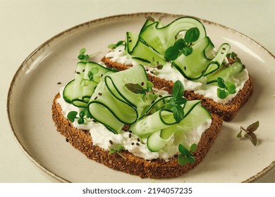 Breakfast, Cereal Bread Sandwiches, Cream Cheese, Sliced Cucumber, With Micro Greenery On A Light Table, Close-up, Top View, Selective Focus, No People,