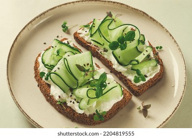 Breakfast, Cereal Bread Sandwiches, Cream Cheese, Sliced Cucumber, With Micro Greenery On A Light Table, Close-up, Top View, Selective Focus, No People,