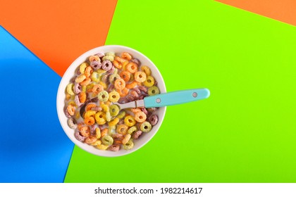 Breakfast cereal, colored grain rings in a bowl - Powered by Shutterstock