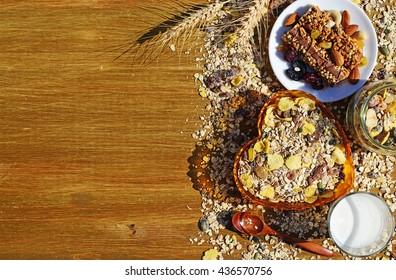 Breakfast with cereal muesli, milk, nuts and berries on wooden background - Powered by Shutterstock