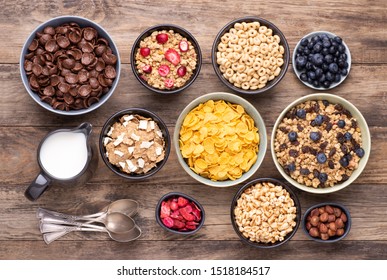 Breakfast cereals in bowls on rustic wooden table, top view - Powered by Shutterstock