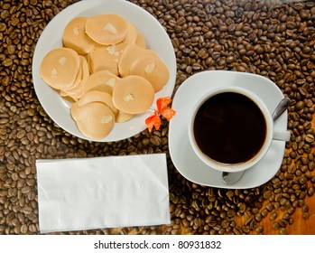 Breakfast with coffee and cookie.