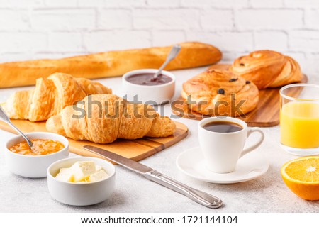 Breakfast with coffee and croissants, selective focus