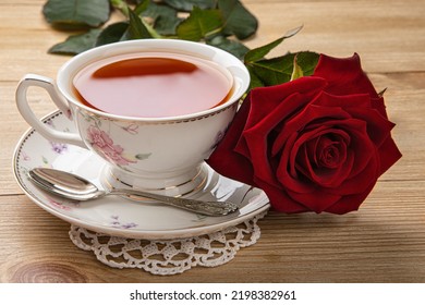 breakfast concept. a cup of tea and a red rose on the table. - Shutterstock ID 2198382961