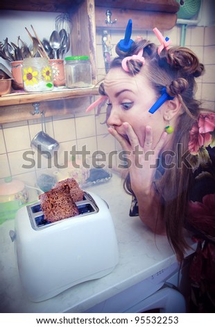 Breakfast disaster. Young woman cooking in her kitchen
