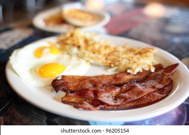 Breakfast Of Eggs, Bacon, And Hash Brown At A Diner.