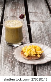 Breakfast Of Eggs, Whole Wheat English Muffin, And Green Smoothie