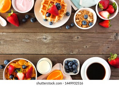 Breakfast food double border. Fruits, cereal, waffles, yogurt, milk and coffee. Top view over a dark wood background with copy space. - Shutterstock ID 1449932516